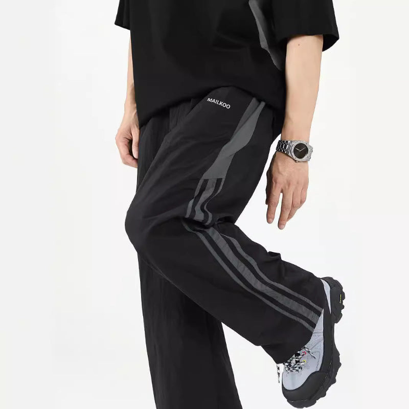 ワイドナイロンパンツ ブラック ディテール&サイドライン High land