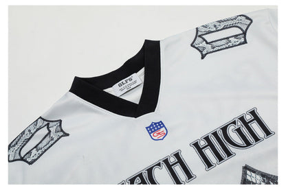 REACH HIGHフットボールTシャツ 蛇柄ビッグナンバー 襟アップディテール Highland